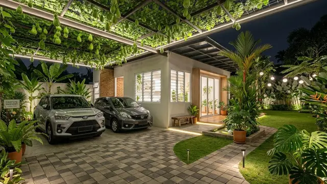 Rumah Sederhana Asri dengan Tanaman Hias dan Carport