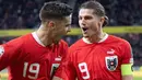 Jeda internasional pada minggu lalu di liga-liga top Eropa yang diisi dengan laga kualifikasi Euro 2024 dan persabatan FIFA Matchday juga melibatkan beberapa pemain Manchester United yang membela timnas masing-masing. Hasilnya, empat pemain MU tampil moncer sebagai pencetak gol dalam laga-laga tersebut. Siapa saja mereka? Berikut daftar keempat pemain tersebut. (AFP/APA/Reinhard Eisenbauer)