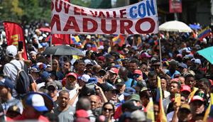 Pendukung mantan Presiden Venezuela, Nicolas Maduro, saat menggelar aksi unjuk rasa di Caracas pada Minggu 4 Januari 2026. Sehari setelah penangkapan oleh pasukan Amerika Serikat (AS), pendukung Presiden Venezuela, Nicolas Maduro, menggelar aksi unjuk rasa di Caracas. (Juan BARRETO/AFP)