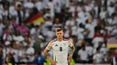 Ekspresi gelandang timnas Jerman, Toni Kroos usai pertandingan perempat final Euro 2024 melawan Spanyol di Stuttgart Arena, Stuttgart, 5 Juli 2024. (Tobias SCHWARZ/AFP)