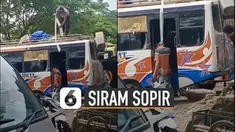 Seorang sopir bus terkena razia membawa minuman beralkohol dan mendapatkan hukuman dari oknum polisi yang menyiramnya dengan minuman beralkohol tersebut.