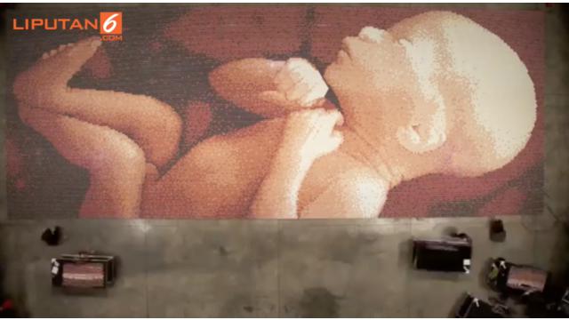 Belo mengklaim mozaik yang ia buat adalah yang terbesar di dunia.