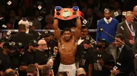 British boxer Anthony Joshua celebrates beating US boxer Charles Martin (not pictured) following their IBF World Heavyweight title boxing match at the O2 arena in London on April 9, 2016.