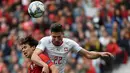 Gelandang Portugal, Joao Felix berebut bola udara dengan Bek Swiss, Fabian Schar selama pertandingan semifinal Liga Bangsa-Bangsa UEFA di stadion Dragao di Porto pada 5 Juni 2019. (AFP Photo/Miguel Riopa)