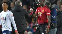 Paul Pogba mengaku menikmati permainannya Manchester United di bawah kendali Ole Gunnar Solskjaer. (AFP/Paul Ellis)