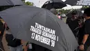 Aksi Kamisan ke-378 bertajuk Kado Kelabu dari Pemerintahan Baru di Hari HAM Internasional digelar di seberang Istana Negara, Jakarta, Kamis (11/12/2014). (Liputan6.com/Miftahul Hayat)