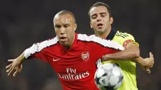 Arsenal's Mikael Silvestre holds off a challenge from Fenerbahce's Semih Senturk during Champions League Group G match at The Emirates Stadium in London on November 5, 2008. AFP PHOTO/Adrian Dennis 