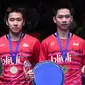 Keberhasilan ini mengantar Kevin/Marcus menjadi ganda putra ke-19 yang sukses mempersembahkan gelar All England untuk Indonesia. (AFP/Justin Tallis)