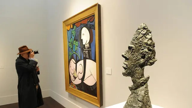 Lukisan Pablo Picasso Nude, Green Leaves and Bust (1932). Photo: Stan Honda/AFP