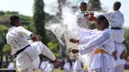 Prajurit TNI menampilkan atraksi bela diri militer saat peringatan HUT ke-78 TNI di Lapangan Puputan Margarana, Denpasar, Bali, Kamis (5/10/2023). Kegiatan yang digelar oleh Kodam IX/Udayana tersebut mengusung tema "TNI Patriot NKRI: Pengawal Demokrasi untuk Indonesia Maju" dengan menampilkan atraksi bela diri militer dan defile pasukan. (SONNY TUMBELAKA/AFP)