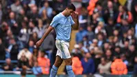 Gelandang Manchester City Rodri bereaksi meninggalkan lapangan setelah mendapat kartu merah dalam pertandingan Liga Inggris melawan&nbsp;Nottingham Forest di Etihad Stadium, Manchester, Sabtu, 23 September 2023. (Oli SCARFF / AFP)