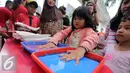Sejumlah bocah ikut berpartisipasi dalam Kampanye Berbagi Tangan Sehat Melalui Cuci Tangan, Jakarta, Minggu (2/10) Dalam rangka menyambut Hari Cuci Tangan Sedunia, Lifebouy memberikan pengetahuan mengenai pentingnya cuci tangan. (Liputan6.com/HelmiAfandi)