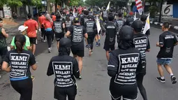 Pelari mengikuti Semarang 10K di Kota Semarang, Jawa Tengah, Minggu (16/12). Semarang 10K berkonsep napak tilas peninggalan sejarah Kota Semarang.  (Liputan6.com/Gholib)