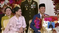 Presiden Joko Widodo atau Jokowi nampak tertawa saat melihat peci panjang yang digunakan Pemenang Pakaian Adat Madura yang dikenakan pemenang bernama Ricky. (YouTube Sekretariat Presiden)