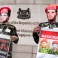 Aksi mereka cukup unik dengan memakai topeng wajah pahlawan nasional Usman-Harun Rabu (26/3/2014) (Liputan6.com/JohanTallo).