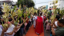 Minggu Palma merupakan sebuah peringatan yang memiliki makna yang mendalam dalam tradisi Katolik. (Ted ALJIBE/AFP)