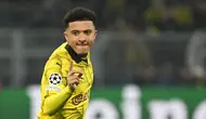 Pemain Borussia Dortmund, Jadon Sancho melakukan selebrasi setelah mencetak gol ke gawang PSV Eindhoven pada laga leg kedua 16 besar Liga Champions 2023/2024 di Signal Iduna Stadium, Dortmund, Jerman, Kamis (14/03/2024) dini hari WIB. (AFP/Ina Fassbender)