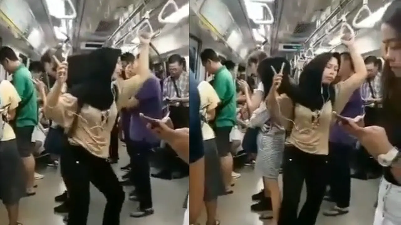 wanita asik joget di kereta