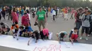 'Aksi Damai 5.000 Tandatangan Suarakan Hak-hak Sipil dan Anak-Perempuan' yang digelar pada Minggu pagi (24/8/2014), langsung menarik perhatian sejumlah warga untuk berpartisipasi, (Liputan6.com/Herman Zakharia)