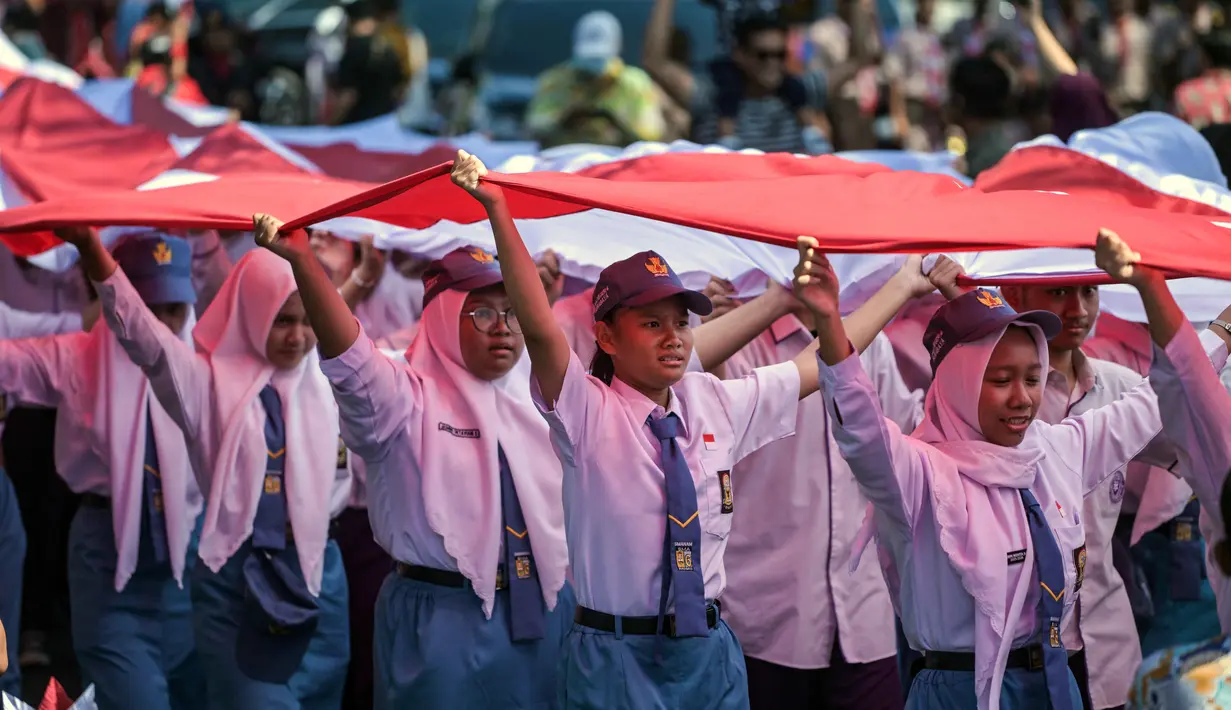 Mereka antusias mengikuti kegiatan yang menjadi rangkaian kemeriahan peringatan HUT ke-80 Republik Indonesia. (Juni KRISWANTO/AFP)