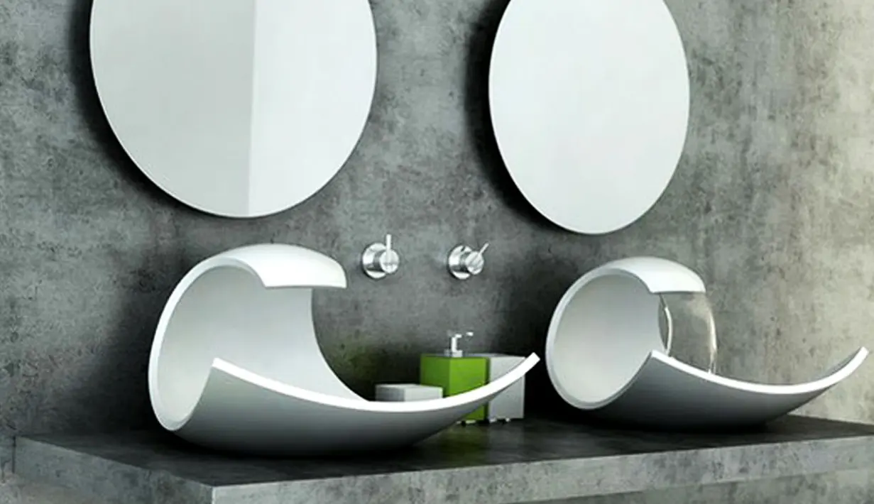 Bentuknya yang melengkung akan mengeluarkan air saat Anda memutar keran. Material yang digunakan adalah batu granit. Wastafel ini Bisa menjadi inspirasi para pecinta batu alam yang ingin menggunakan material batu pada kamar mandi. (www.ideaonline.co.id)