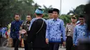 Presiden Joko Widodo (Jokowi) menghadiri upacara HUT ke-45 Korps Pegawai Republik Indonesia (Korpri) di Silang Monas, Jakarta, Selasa (29/11). Jokowi disambut oleh muda-mudi dari 34 provinsi. (Liputan6.com/Faizal Fanani)