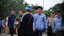 Presiden Joko Widodo (Jokowi) menghadiri upacara HUT ke-45 Korps Pegawai Republik Indonesia (Korpri) di Silang Monas, Jakarta, Selasa (29/11). Jokowi disambut oleh muda-mudi dari 34 provinsi. (Liputan6.com/Faizal Fanani)