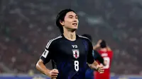 Pemain Timnas Jepang,&nbsp;Takumi Minamino, merayakan gol ke gawang Timnas Indonesia pada Kualifikasi Piala Dunia 2026 Zona Asia di Stadion Gelora Bung Karno, Senayan, Jakarta, Jumat (15/11/2024) malam WIB. (Bola.com/Abdul Aziz)