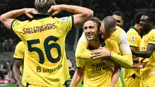 Pemain AC Milan, Luka Modric, merayakan gol yang dicetaknya ke gawang Bologna pada pekan 3 Liga Italia Serie A di Stadion San Siro, Senin (15/9/2025) dini hari WIB. (Stefano RELLANDINI / AFP)