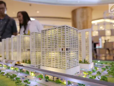 Sebuah maket plan LRT City yang mengusung konsep Transit Oriented Development (TOD) digelar pada pameran properti LRT City Expo di Jakarta, Sabtu (21/7). Pameran konsep urban lifestyle menghadirkan tujuh proyek LRT City. (Liputan6.com)