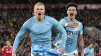Pemain Manchester City, Erling Haaland, melakukan selebrasi setelah mencetak gol ke gawang Liverpool pada laga Liga Inggris di Stadion Anfield, Senin (9/2/2026) dini hari WIB. (AP Photo/Jon Super)