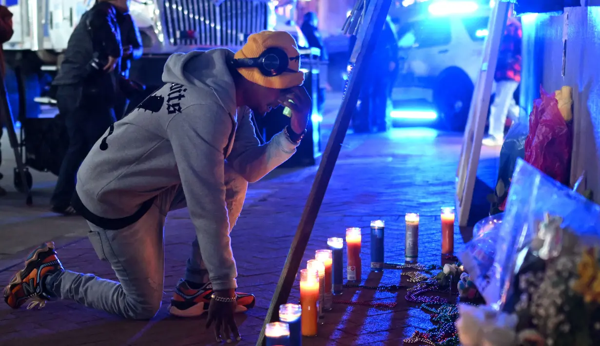 Peristiwa tragis itu menewaskan 14 orang dan sedikitnya 35 lainnya terluka, termasuk dua petugas polisi. (ANDREW CABALLERO-REYNOLDS/AFP)