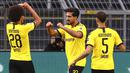 Pemain Borussia Dortmund, Emre Can, melakukan selebrasi usai membobol gawang Hertha Berlin pada laga Bundesliga di Stadion di Signal Iduna Park, Sabtu (6/6/2020). Borussia Dortmund menang 1-0 atas Hertha Berlin. (AP/Lars Baron)