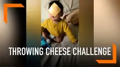 Muncul challenge nyeleneh, seorang bayi jadi sasarannya. Disebut 'Throwing Cheese Challenge' di mana para orang dewasa melempar keju ke wajah bayi.