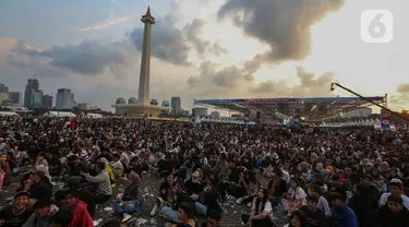 Ribuan orang memadati area HUT ke-78 Bhayangkara di Kawasan Monumen Nasional (Monas), Jakarta, Senin (1/7/2024). (Liputan6.com/Angga Yuniar)