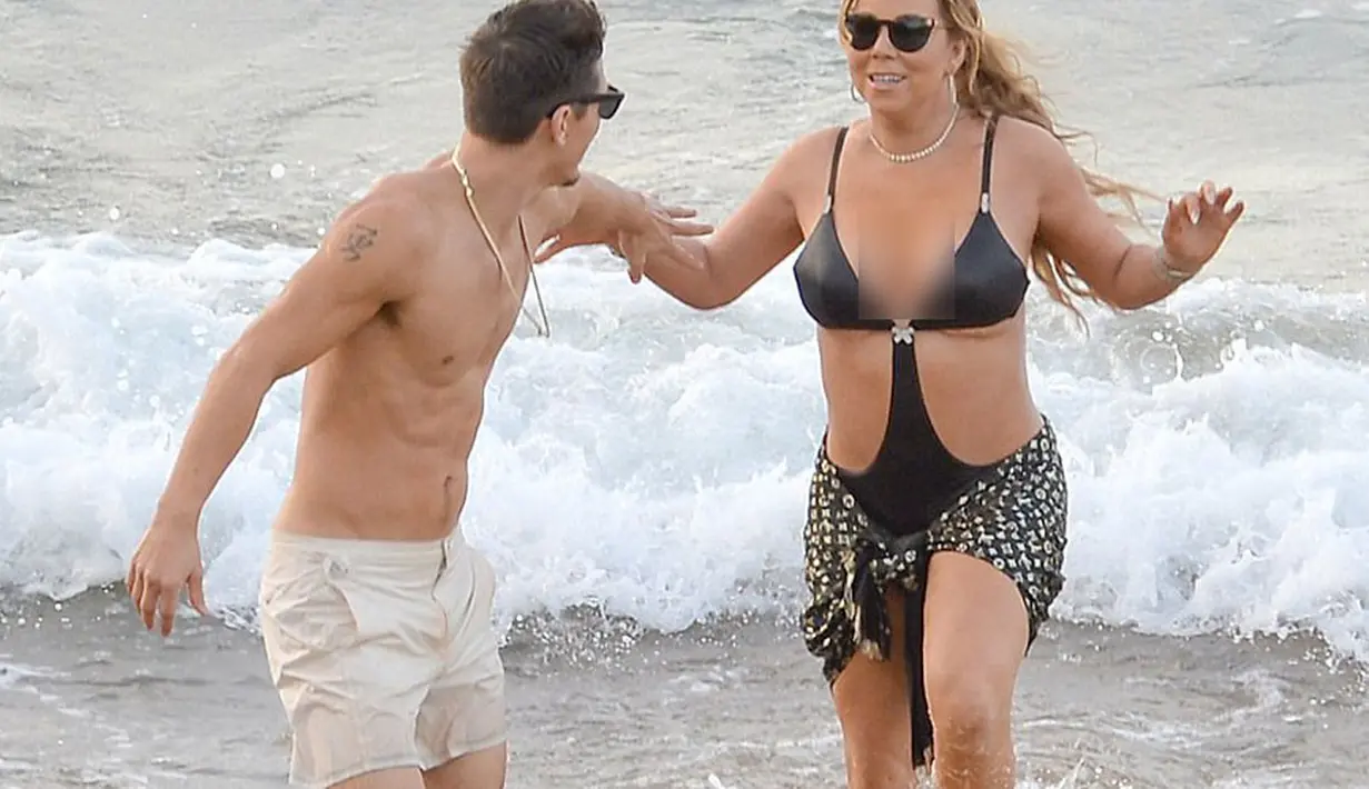 Tersebar video dimana Mariah tengah menggoda Bryan dan duduk dipangkuan pelatih koreografernya itu. Dari situlah yang menjadi awal dari kemarahan James. (doc.dailymail.com)