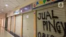 Suasana sepi diantara kios yang tutup di Roxy Square, Jakarta, Jumat (3/9/2021). PPKM Darurat yang berlaku Juni lalu serta beberapa pembatasan sebelumnya membuat pergerakan masyarakat sempat tertahan. (Liputan6.com/Faizal Fanani)