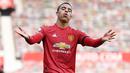 Striker Manchester United, Mason Greenwood, melakukan selebrasi usai mencetak gol ke gawang Burnley pada laga Liga Inggris di Stadion Old Trafford, Minggu (18/4/2021). MU menang 3-1 Burnley. (Photo by GARETH COPLEY/POOL/AFP)