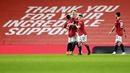 Pemain Manchester United, Scott McTominay, melakukan selebrasi usai mencetak gol ke gawang Southampton pada laga Liga Inggris di Stadion Old Trafford, Selasa (2/2/2021). Setan Merah menang dengan skor 9-0. (Laurence Griffiths/Pool via AP)