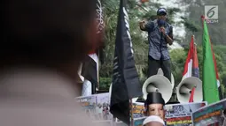 Massa GMI berorasi  di depan Kedubes Australia, Jakarta (26/11). Unjuk rasa bertema "Aksi Bela Palestina" mengutuk rencana PM Australia Scott Morisson untuk memindahkan kedubes negaranya di Israel dari Tel Aviv ke Yerusalem. (Liputan6.com/Iqbal S Nugroho)