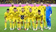 Pemain Malaysia berpose sebelum pertandingan kualifikasi Piala Asia AFC Grup F antara Malaysia dan Vietnam di Stadion Nasional Bukit Jalil, Kuala Lumpur, pada 10 Juni 2025. (Mohd RASFAN/AFP)