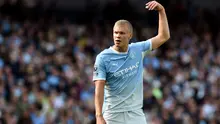 Selebrasi striker Manchester City Erling Haaland usai merobek gawang Coventry City pada laga Liga Inggris 2026/2027, Sabtu (5/9/2026). (AFP/Peter Powell)