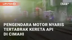 Pengendara motor nyaris tertabrak kereta di perlintasan KA JPL 154 Cimindi, Cimahi. Kejadian terjadi pada Senin (16/12/2024) saat pengendara nekat menerobos rel