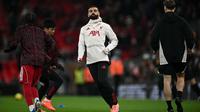 Penyerang Liverpool, Mohamed Salah, melakukan pemanasan menjelang pertandingan Liga Inggris antara Liverpool dan Sunderland di Anfield, Liverpool, Inggris barat laut, pada 3 Desember 2025. (Paul ELLIS / AFP)