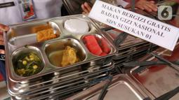 Pemerintah mulai melaksanakan program makan bergizi gratis perdana di 26 provinsi di seluruh Indonesia. (Liputan6.com/Herman Zakharia)