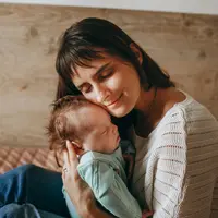 baby with mom/copyright pexels/Helena Lopes