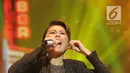 Penyanyi Agnes Monica alias Agnez Mo saat Konser Raya 24 Tahun Indosiar Luar Biasa di JCC Senayan, Jakarta, Jumat (11/1). Agnez Mo membawakan tiga lagu saat tampil bersama Iwan Fals. (Fimela.com/Bambang Eros)