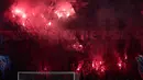 Pendukung Paris Saint-Germain (PSG) merayakan kemenangan Les Parisiens atas Arsenal pada pertandingan leg kedua semifinal Liga Champions 2024/2025 di Stadion Parc des Princes, Paris, pada 7 Mei 2025 waktu setempat atau Kamis (8/5/2025) WIB dini hari. (Thibaud MORITZ/AFP)