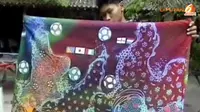 Ingin menjadi bagian dalam euforia piala dunia, siswa sekolah seni rupa mengabadikannya dalam lembaran kain batik. (Liputan6 TV)