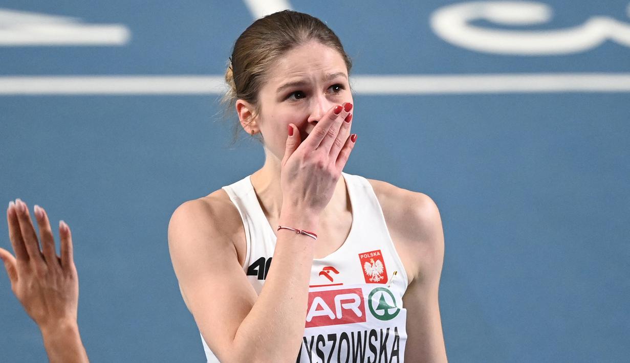 Ekspresi Pia Skrzyszowska dari Polandia saat memenangkan semi final perlombaan lari gawang 60m putri dalam Kejuaraan Atletik Indoor Eropa 2021 di Torun. (Foto: AFP/Sergei Gapon)